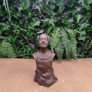 Buste de Coluche en salopette